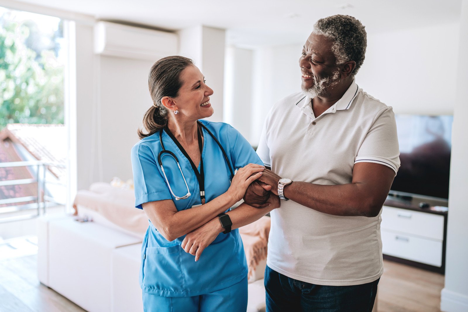 A nurse supporting an elderly client at home